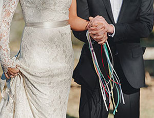 wedding couple with handfasting ribbons